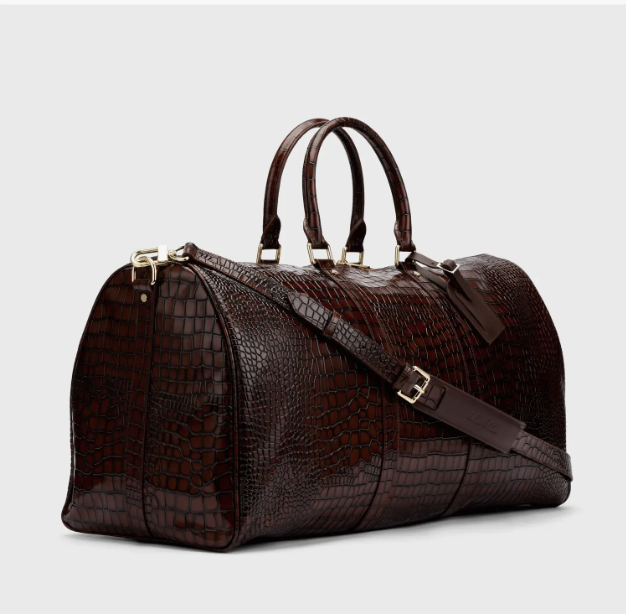 ANINE BING Leo canvas tote in a black-and-brown leopard print.