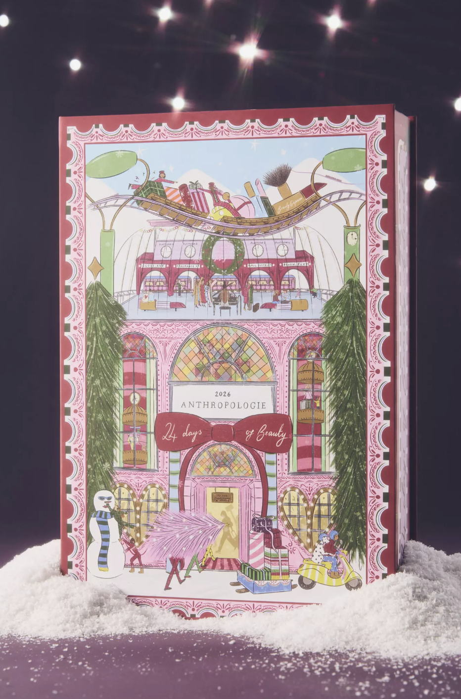 Anthropologie 24 Days of Beauty Advent Calendar displaying its illustrated holiday townhouse box set against a snow-dusted background.