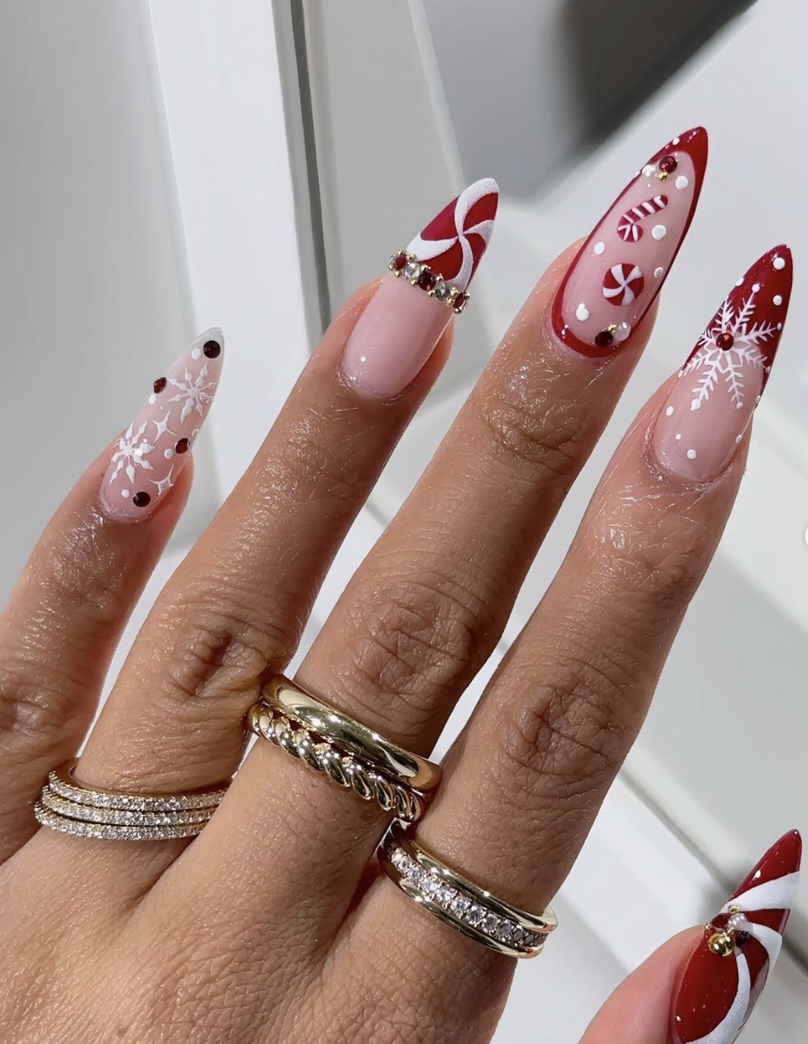 Candy cane nail ideas with red, white, pink and peppermint stripe designs for Christmas