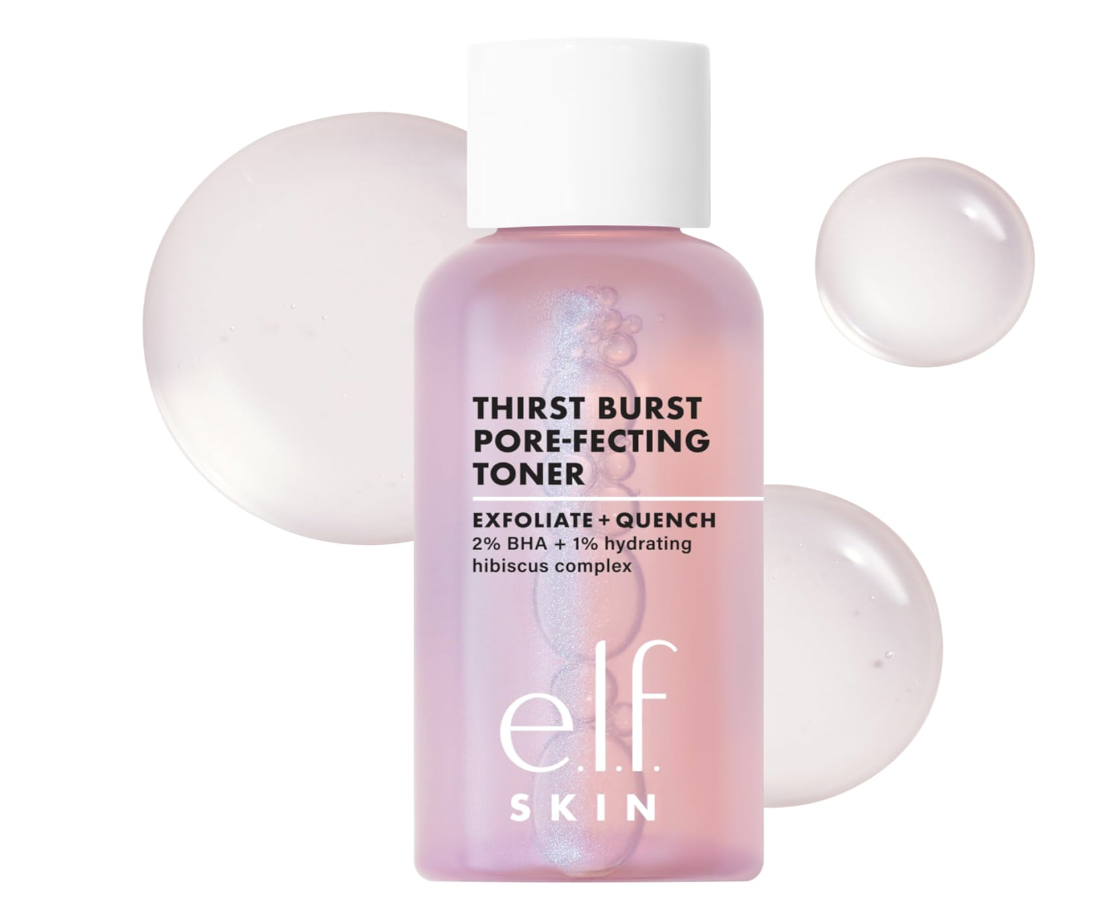 A close-up of the e.l.f. SKIN Thirst Burst Pore-fecting Toner bottle surrounded by pink liquid droplets on a clean white background.