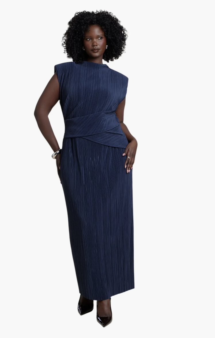 Rust-orange ELOQUII pleated maxi dress with a draped bodice and high neckline.
