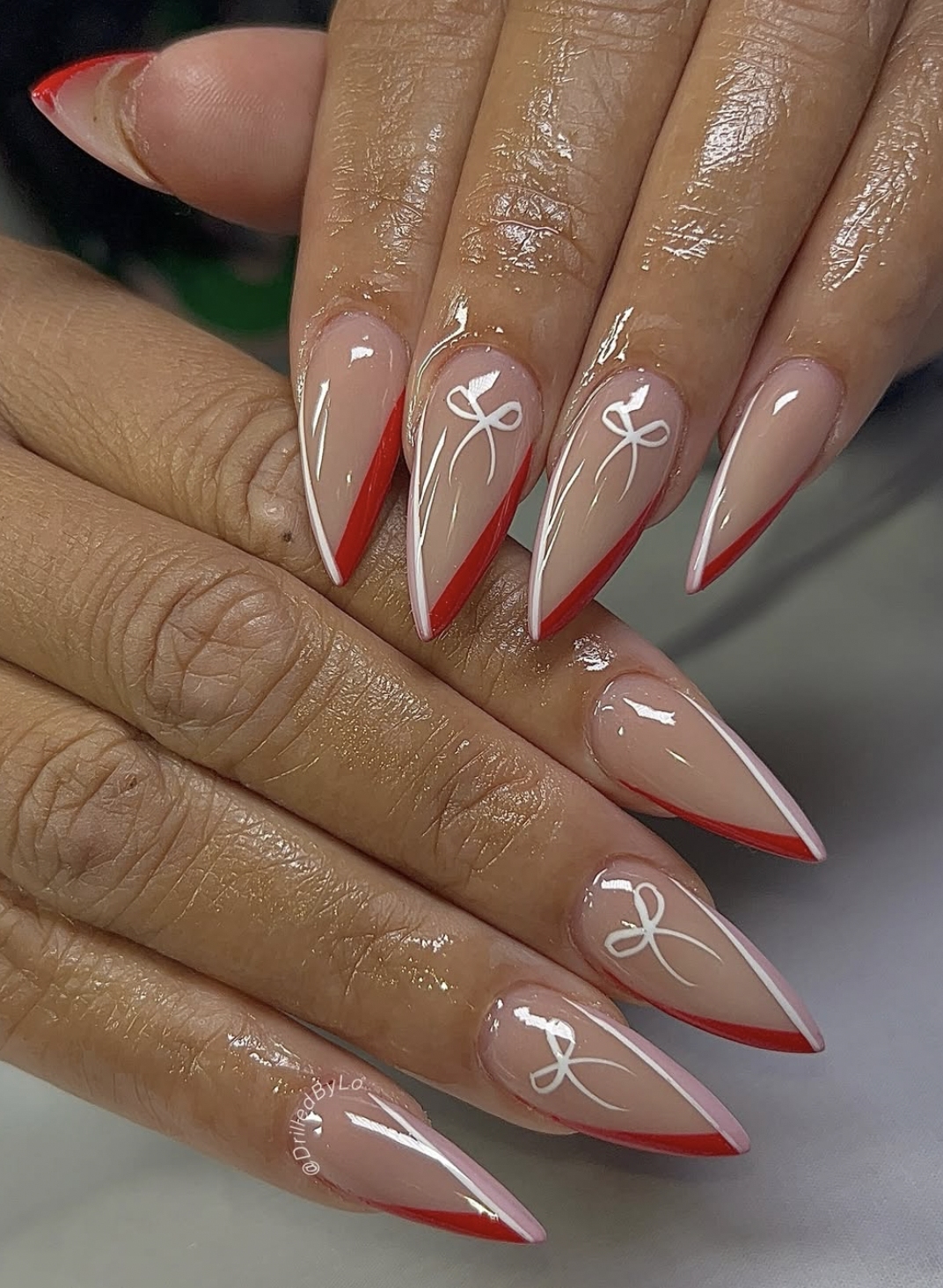Simple Christmas manicure with a small bow accent nail