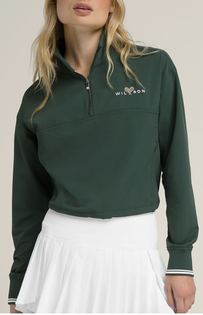 Dark green Wilson Davenport quarter-zip sweatshirt with a white logo on the chest and a stand-up collar.