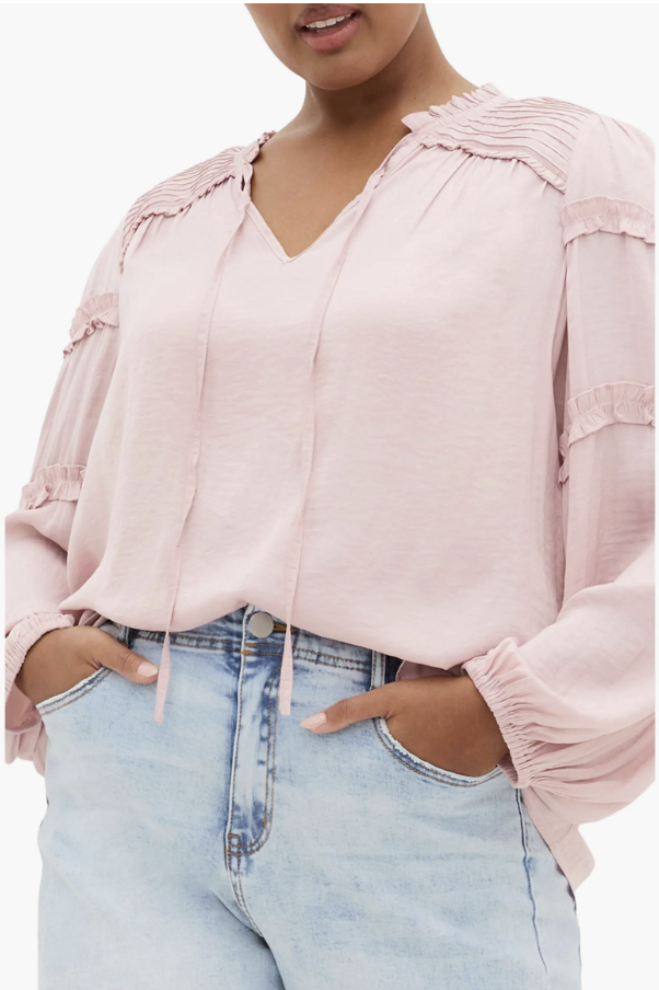 City Chic peasant blouse with romantic ruffle-trimmed puff sleeves.