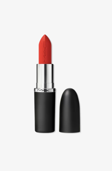 A close-up shot of an open tube of MAC Lady Danger Matte Lipstick, showcasing the vibrant, bright coral-red shade that perfectly complements a Spring color palette.