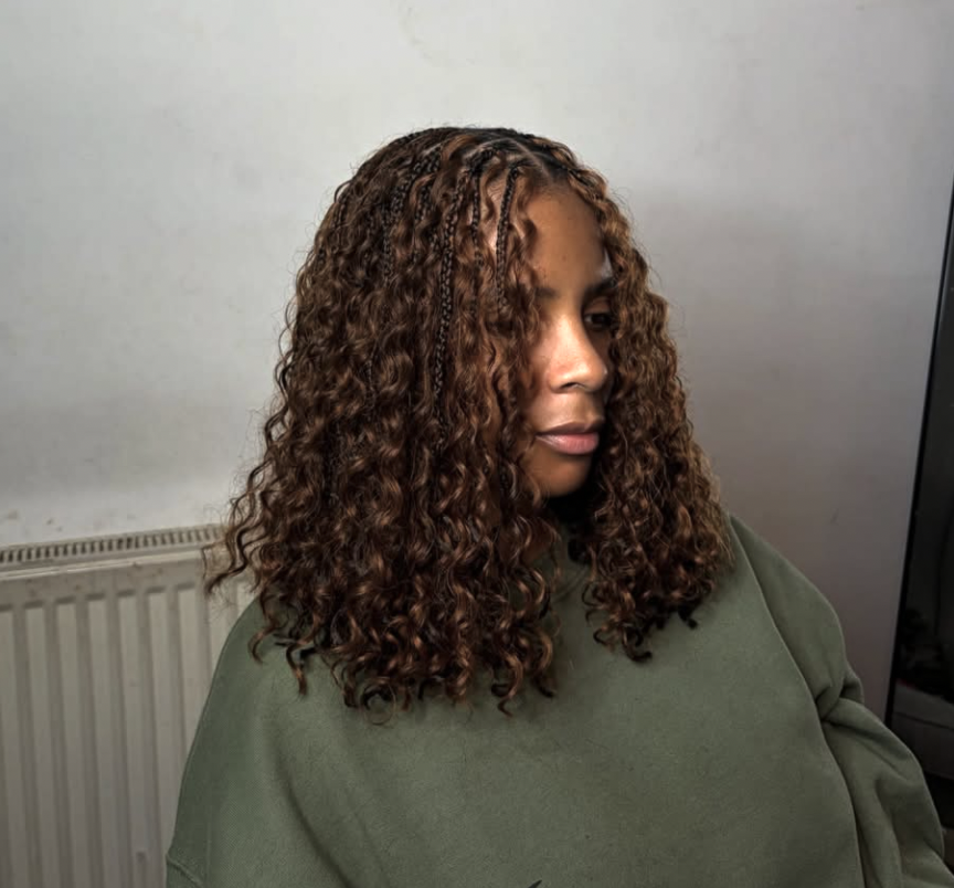 Short boho bob braids with loose face-framing curls. Knotless bob