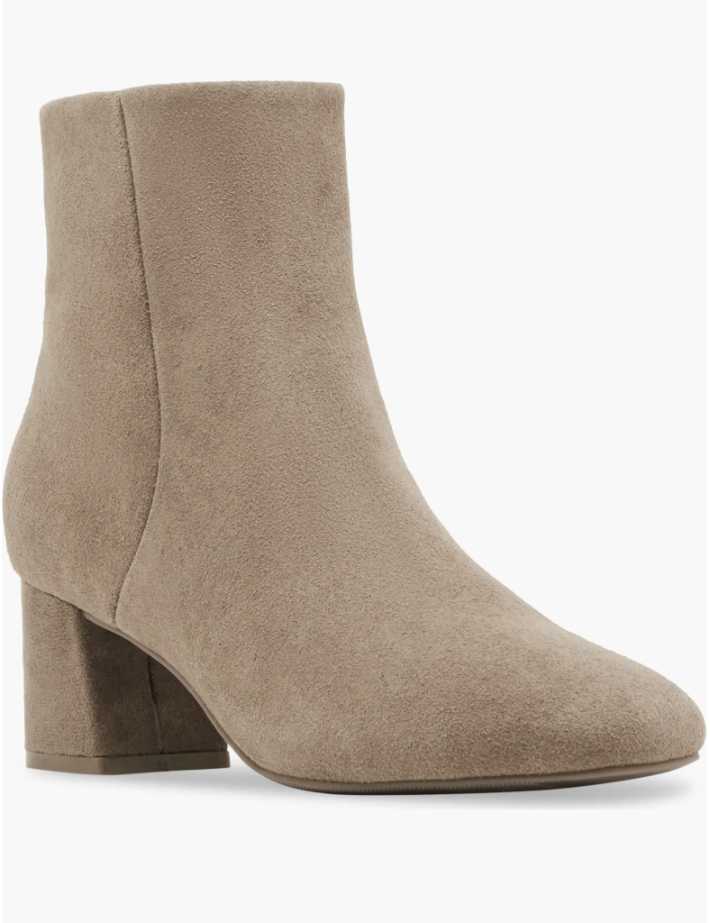 Close up of a taupe suede block heel ankle boot, the Blondo Alida waterproof bootie, styled for a fall or winter outfit.