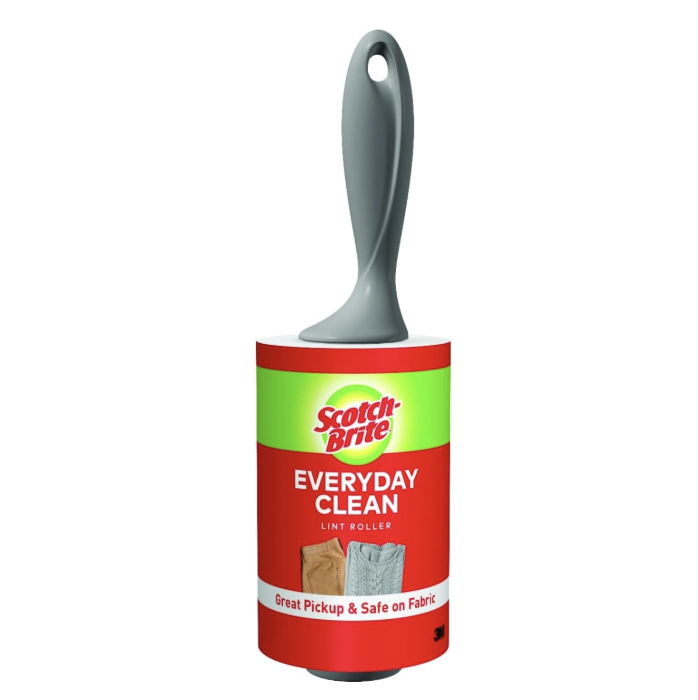 A Scotch-Brite Everyday Clean lint roller with a red ergonomic handle and white adhesive sheets.
