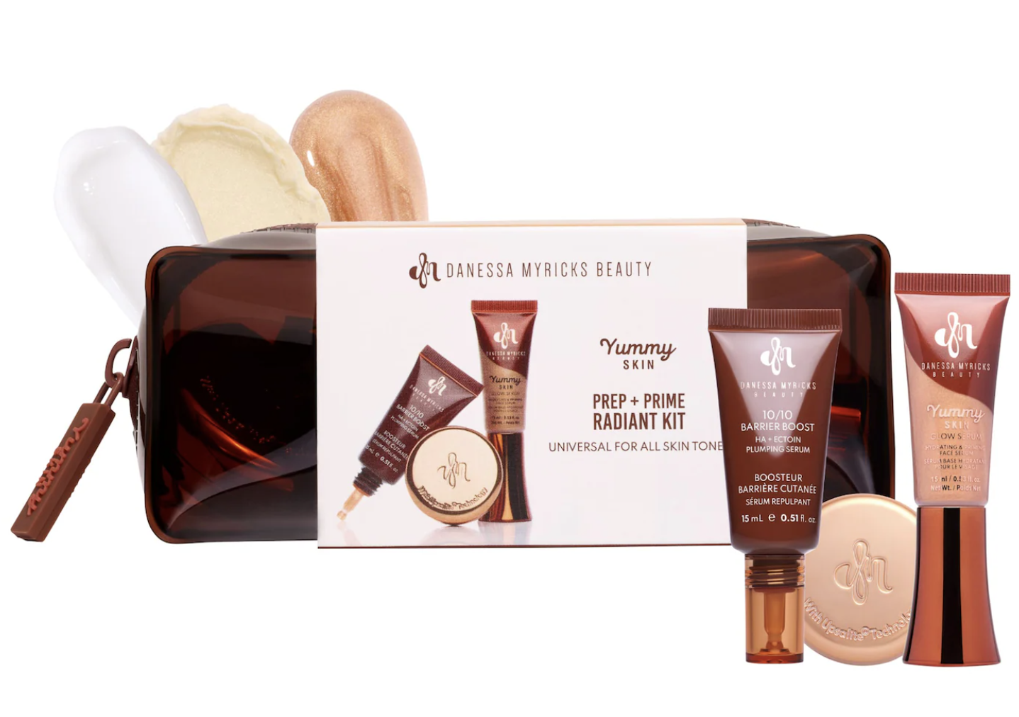: A product shot of the Danessa Myricks Beauty Yummy Skin Prep and Prime Radiant Kit, showcasing a brown makeup bag next to the boxed set and cream product swatches.
