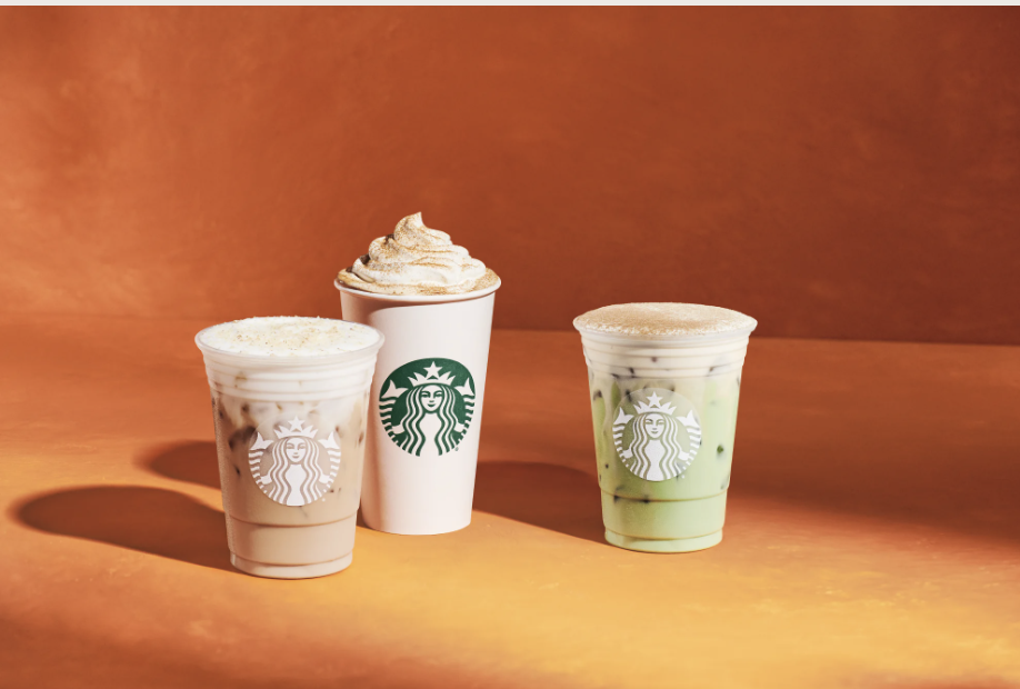 Three Starbucks fall drinks, including iced, hot and matcha beverages, displayed against an orange background.