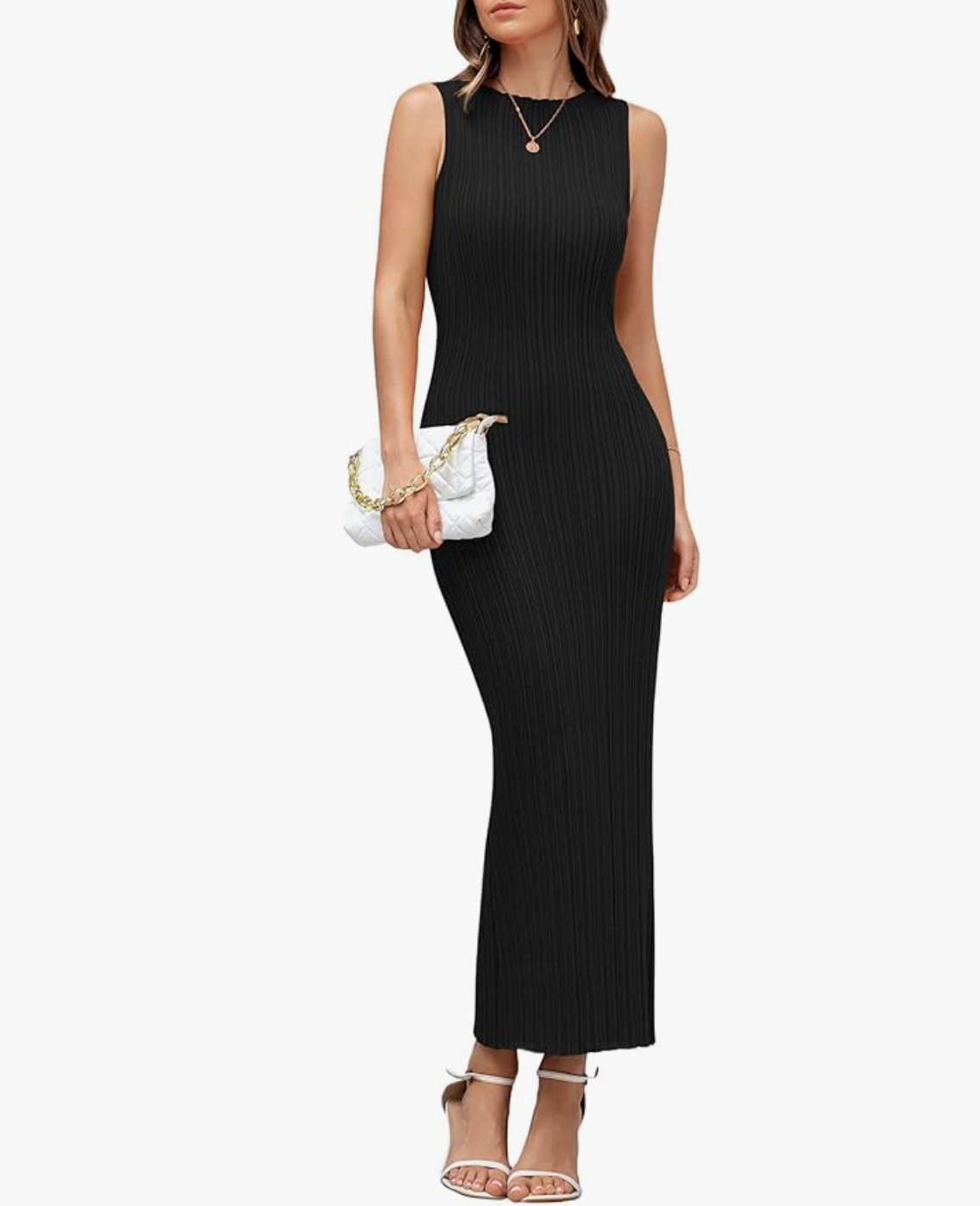 A woman styling a monochrome summer outfit formula featuring a sleeveless, high-neck black ribbed midi dress, a white quilted clutch bag with a gold chain, and a delicate gold pendant necklace.