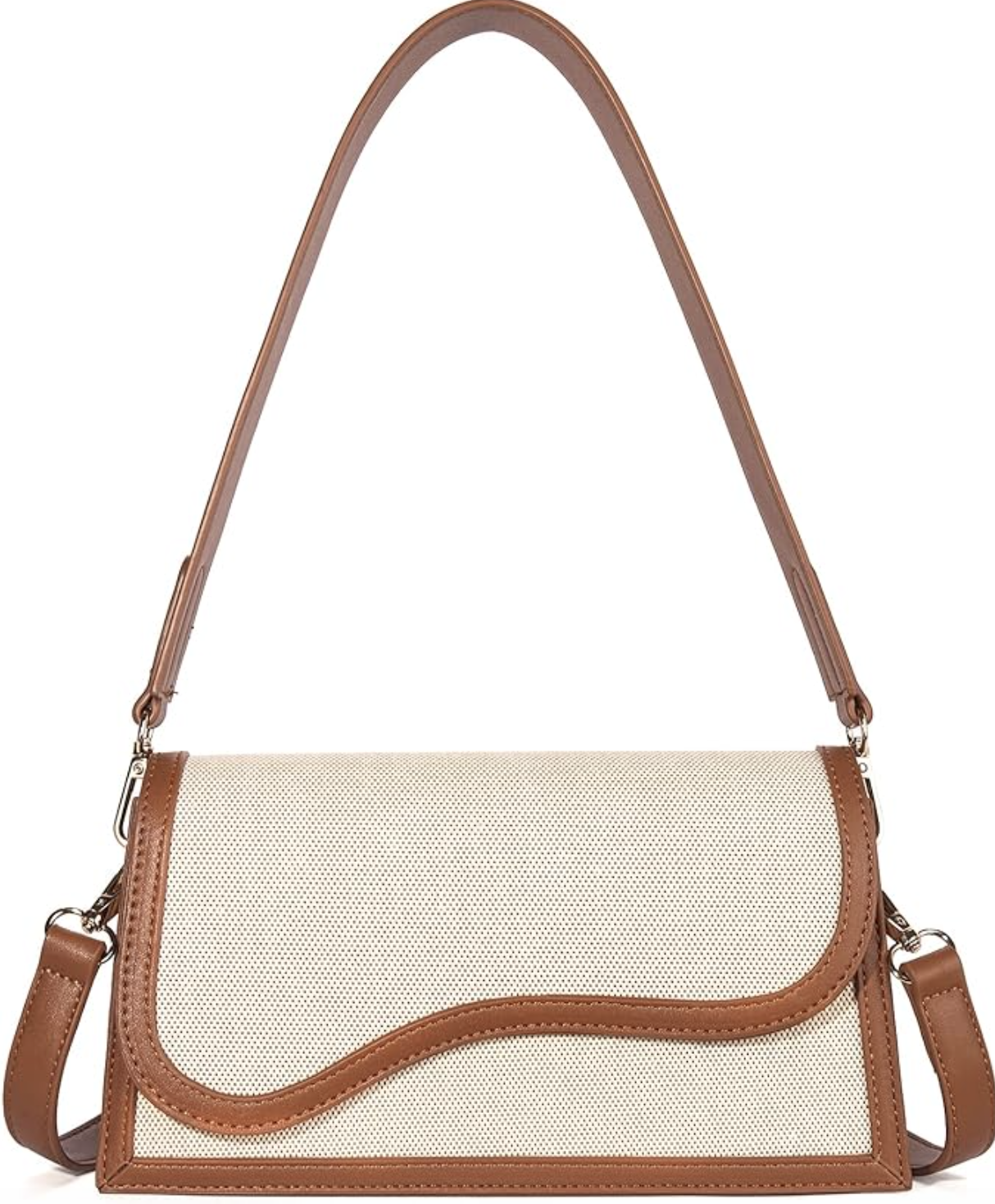 An ivory canvas and tan vegan leather shoulder bag with a curved bottom, featuring a matching tan leather shoulder strap and silver metal hardware.