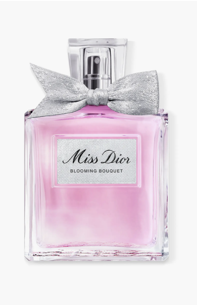 A 3.4-ounce bottle of Miss Dior Blooming Bouquet Eau de Toilette featuring a clear glass design with a silver couture bow on the cap and a pink liquid interior.