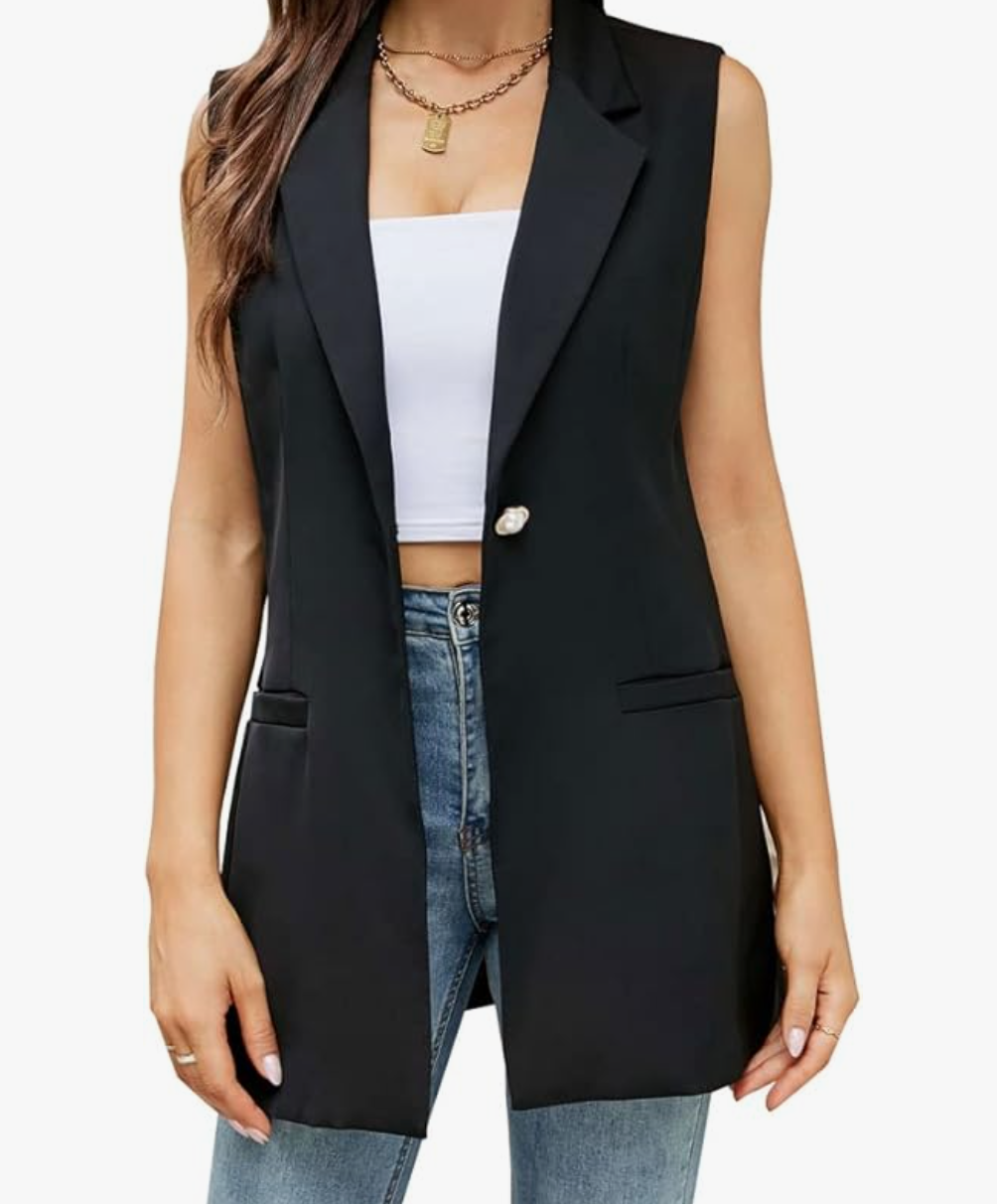 A woman wearing a long, black Fully Lined Spring Casual Open Front Vest over a white top and denim jeans, showcasing a polished and professional layered look.