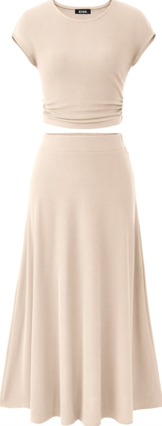 A beige two-piece set for women featuring a short-sleeve cropped top and a matching pleated midi skirt, styled as a spring outfit idea to wear with flats for women.