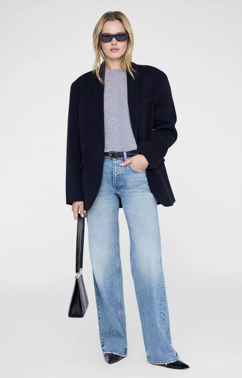 Professional style hack: the Anine Bing Quinn Blazer in black, featuring an oversized wool-cashmere blend and structured shoulders, styled with wide-leg light wash jeans for a quiet luxury aesthetic.