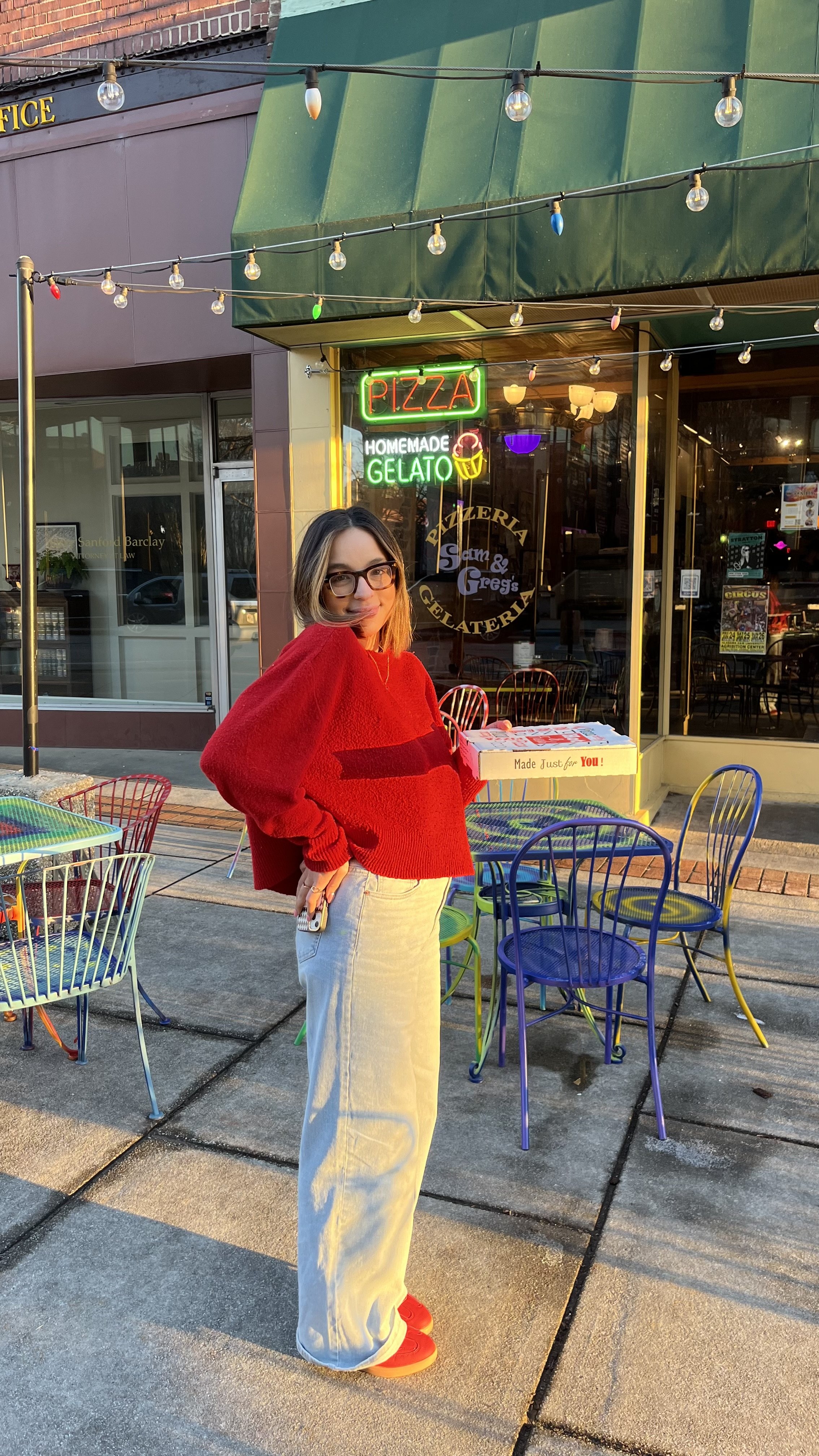 woman posing at a coffee shop