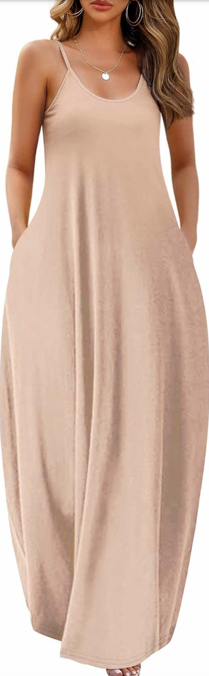 A woman wearing a loose-fitting, sleeveless beige maxi dress with a deep v-neck, styled for a casual summer outfit.