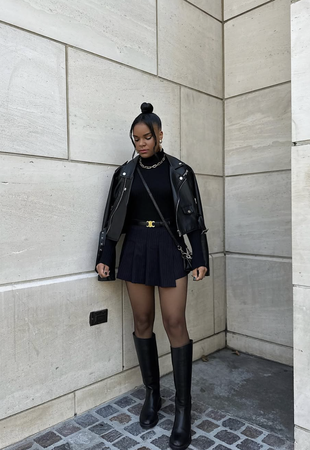 Full-length mini skirt tights knee boots outfit showing the complete boot shaft and shoes