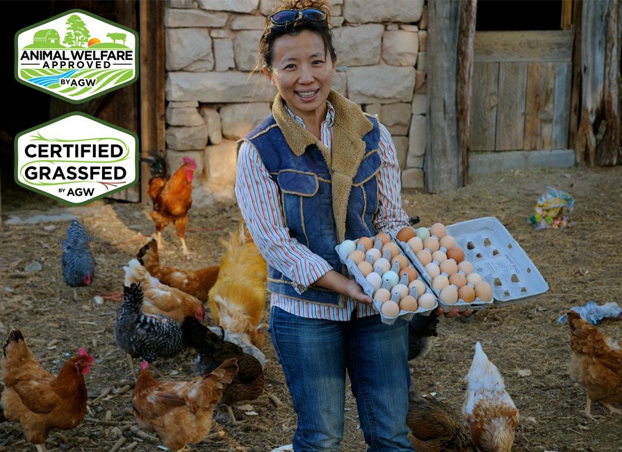 Ming celebrating her henhouse bounty.