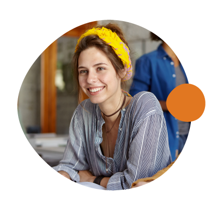 Smiling young woman with a yellow headband sitting at a table