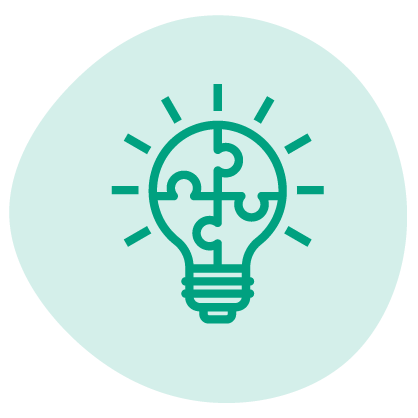 Light bulb with puzzle pieces inside, representing ideas or creativity.
