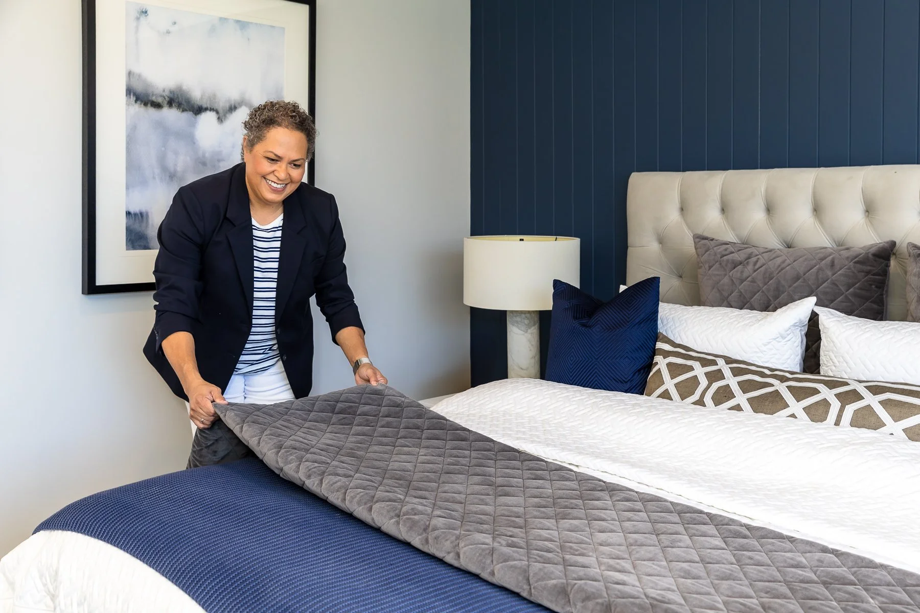 Making beds for a home concierge service in display homes in Box Hill make for amazing branding photography locations