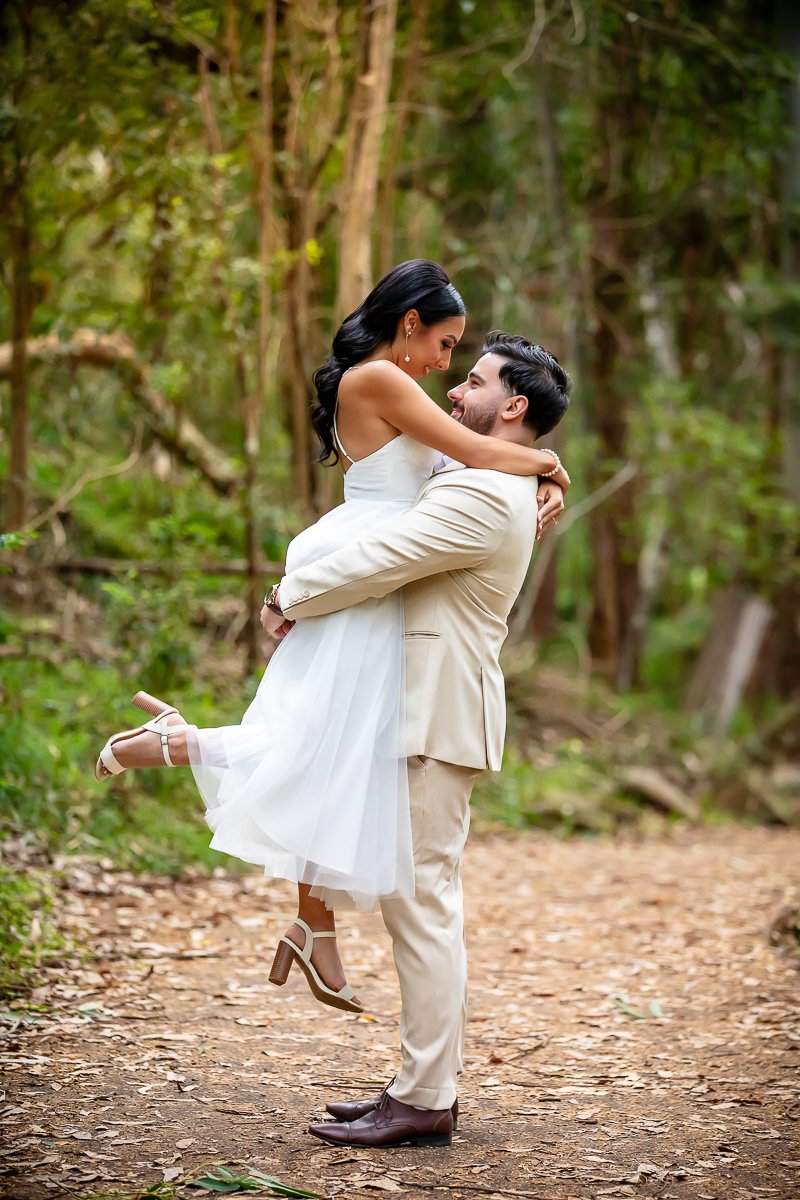 A man lifting a women in the bush