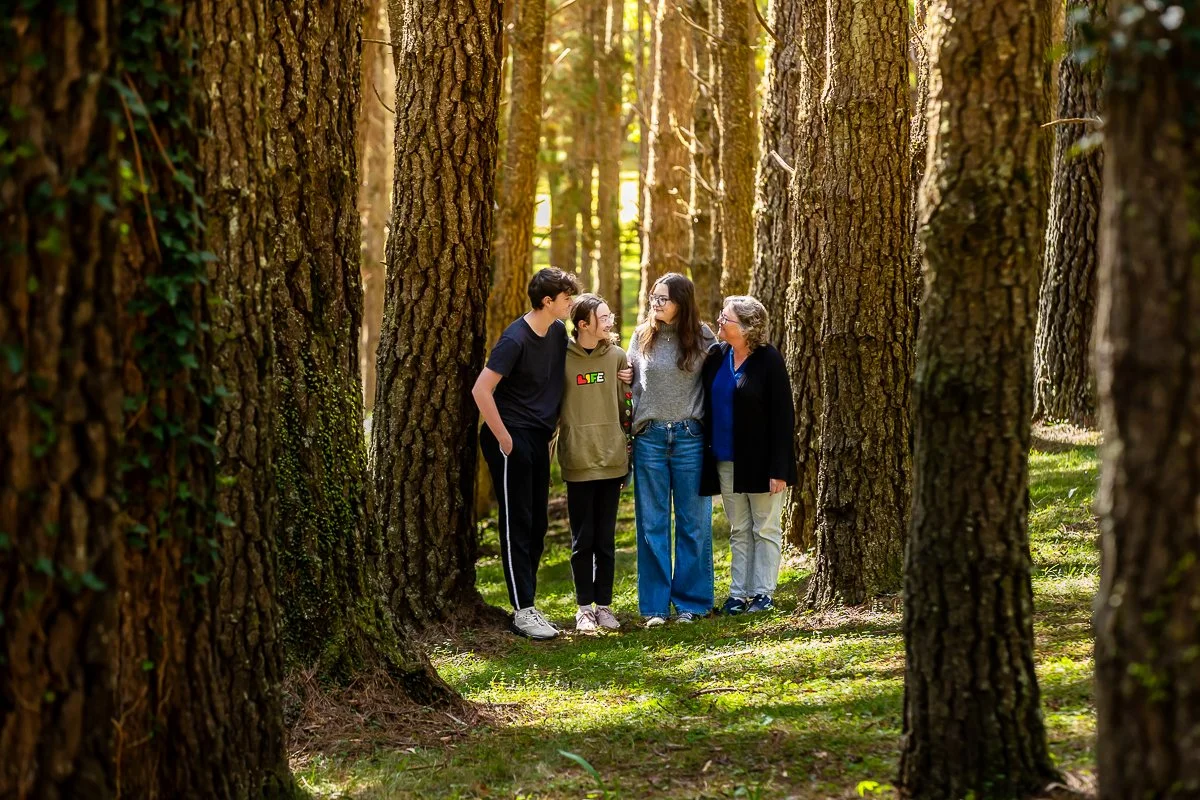 A family in the gorgeous autumn colours at Breenhold Gardens in Mount Wilson in the Blue Mountains during a family photoshoot