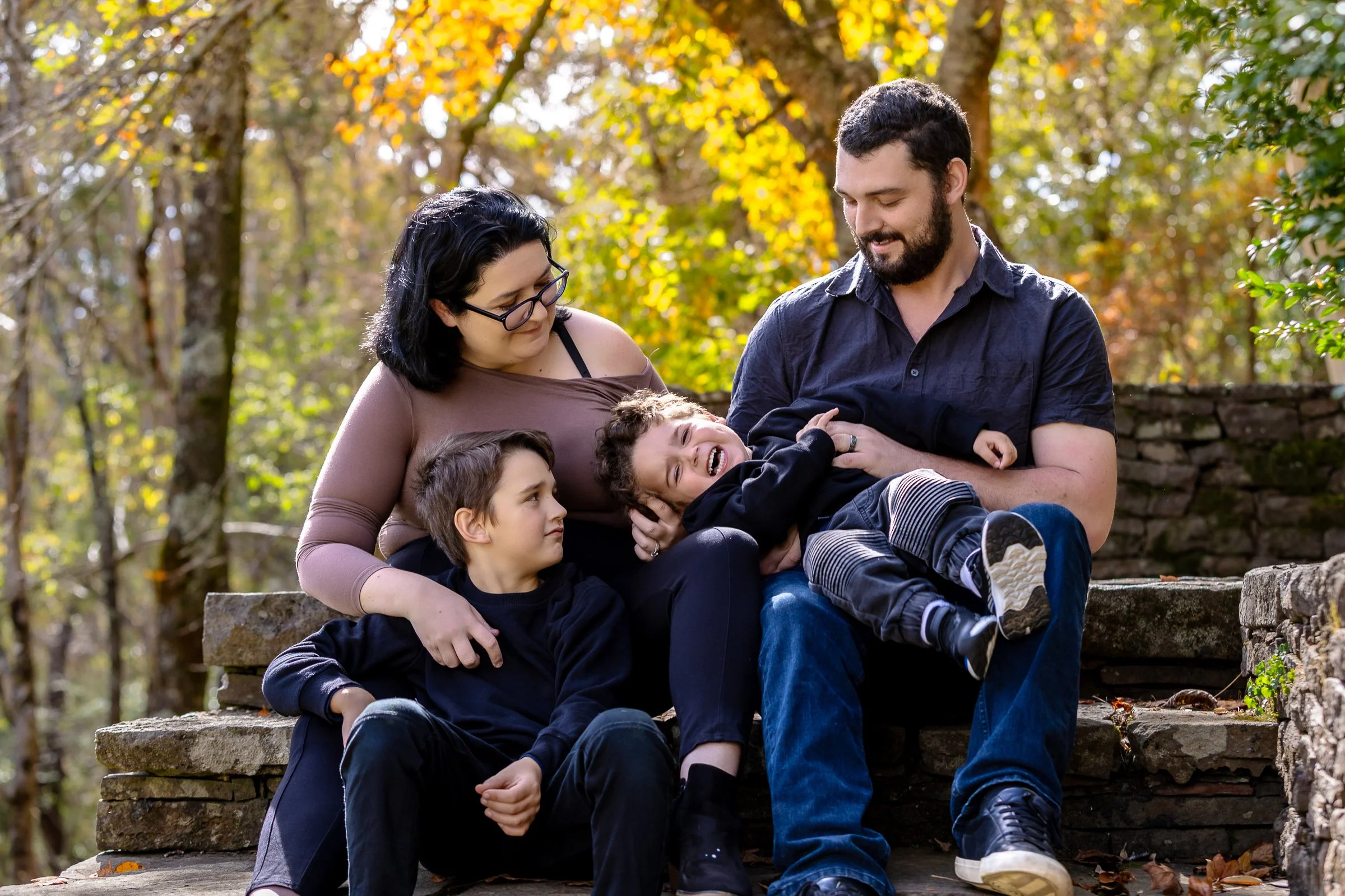A family in the gorgeous autumns colours at Everglades Gardens in Leura in the Blue Mountains during a family photoshoot