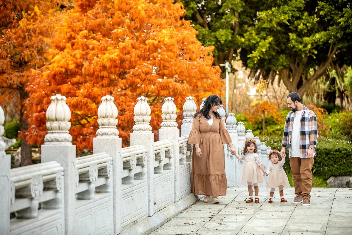 A family at Nurragingy Reserve in Sydney's Western Suburbs for a family photoshoot during the stunning colours of autumn