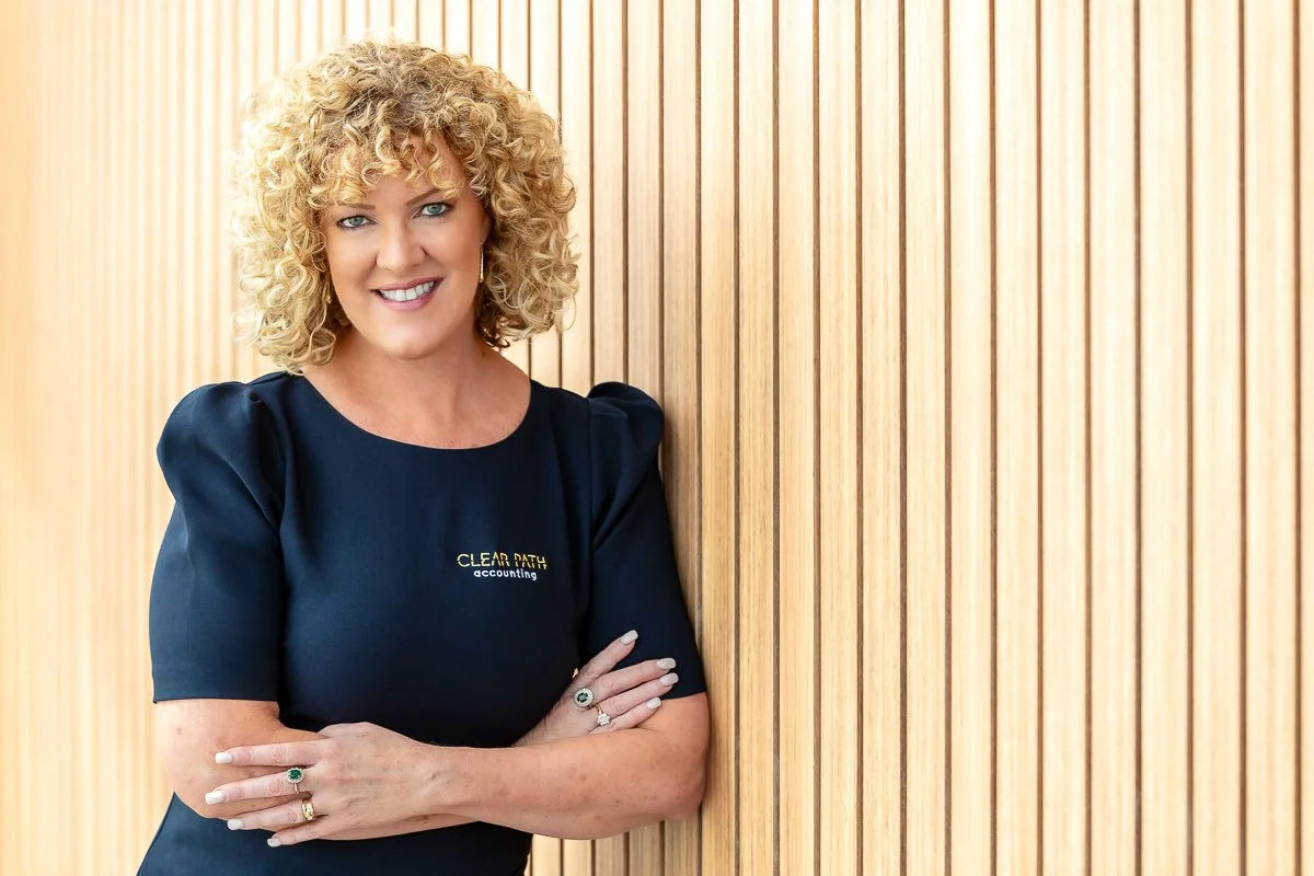Business woman leaning on a wall in the Pullman Hotel in Penrith
