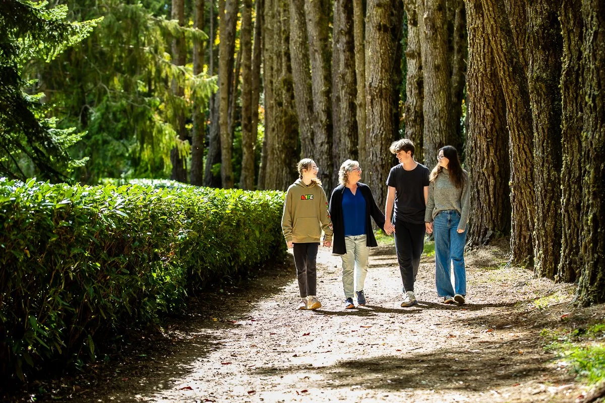 A family in the gorgeous autumn colours at Breenhold Gardens in Mount Wilson in the Blue Mountains during a family photoshoot