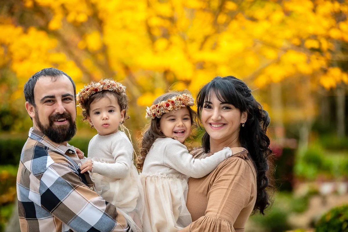 A family at Nurragingy Reserve in Sydney's Western Suburbs for a family photoshoot during the stunning colours of autumn