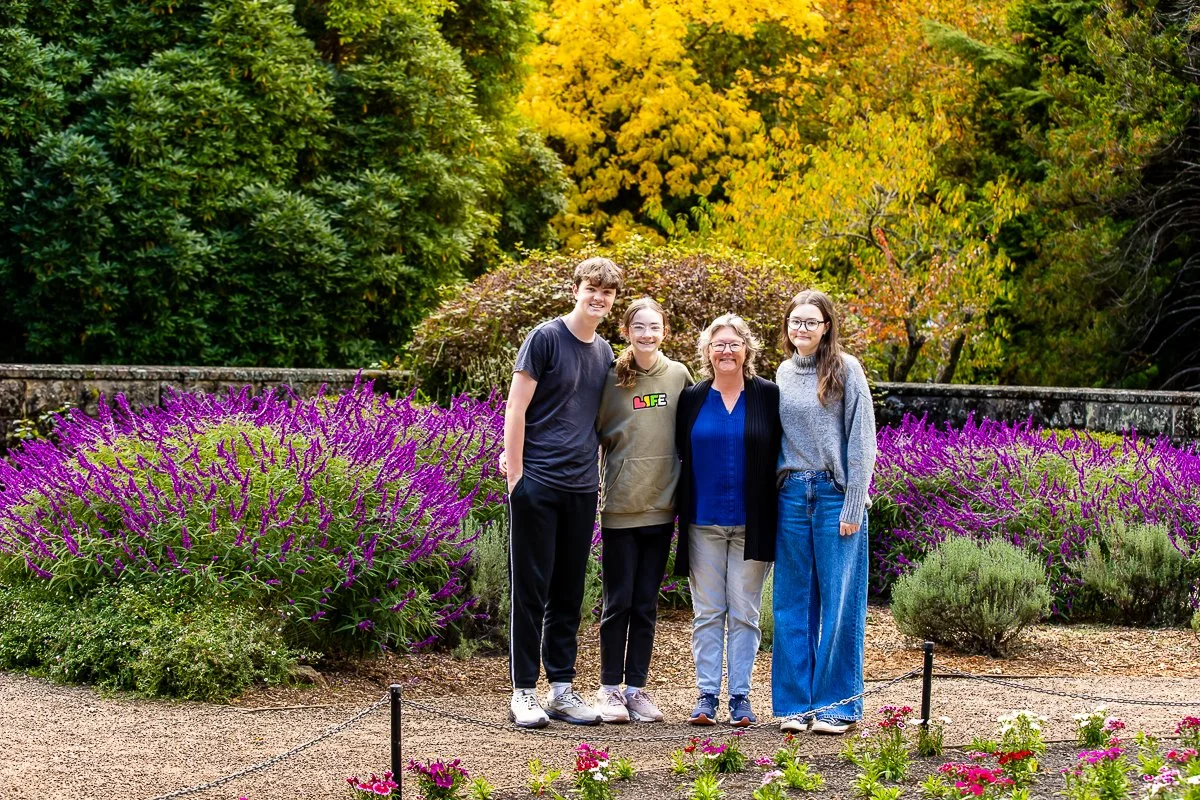 A family in the gorgeous autumn colours at Breenhold Gardens in Mount Wilson in the Blue Mountains during a family photoshoot