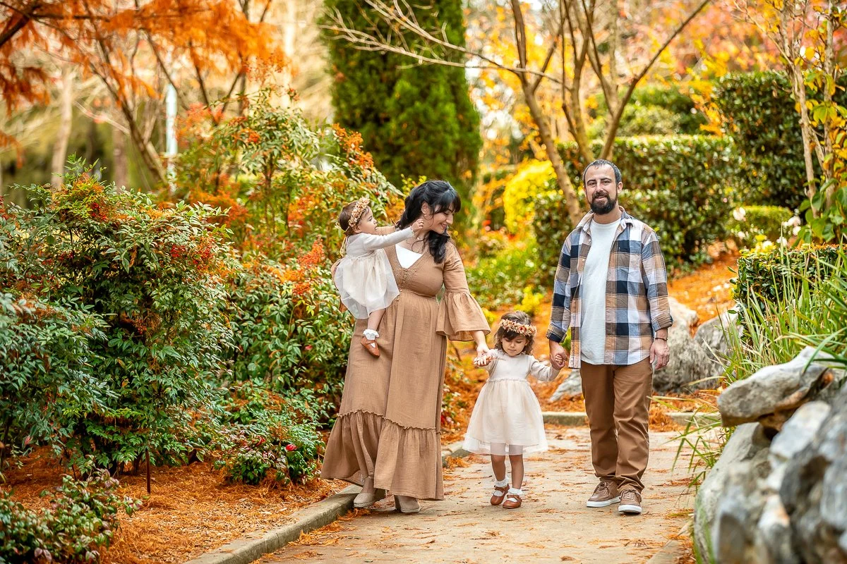 A family at Nurragingy Reserve in Sydney's Western Suburbs for a family photoshoot during the stunning colours of autumn