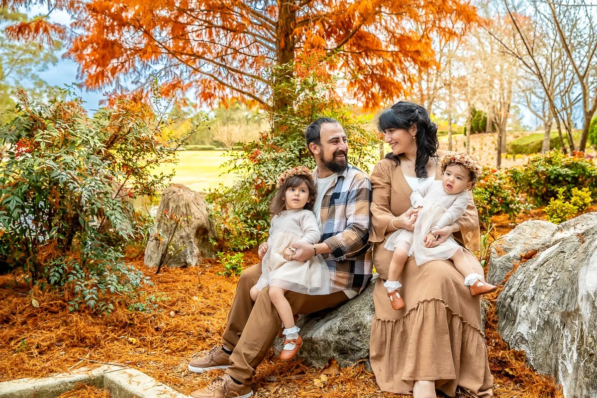 A family at Nurragingy Reserve in Sydney's Western Suburbs for a family photoshoot during the stunning colours of autumn