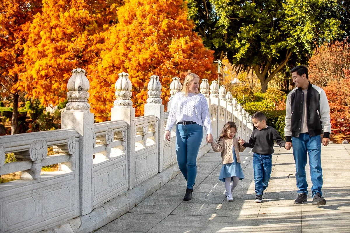 A family at Nurragingy Reserve in Sydney's Western Suburbs for a family photoshoot during the stunning colours of autumn