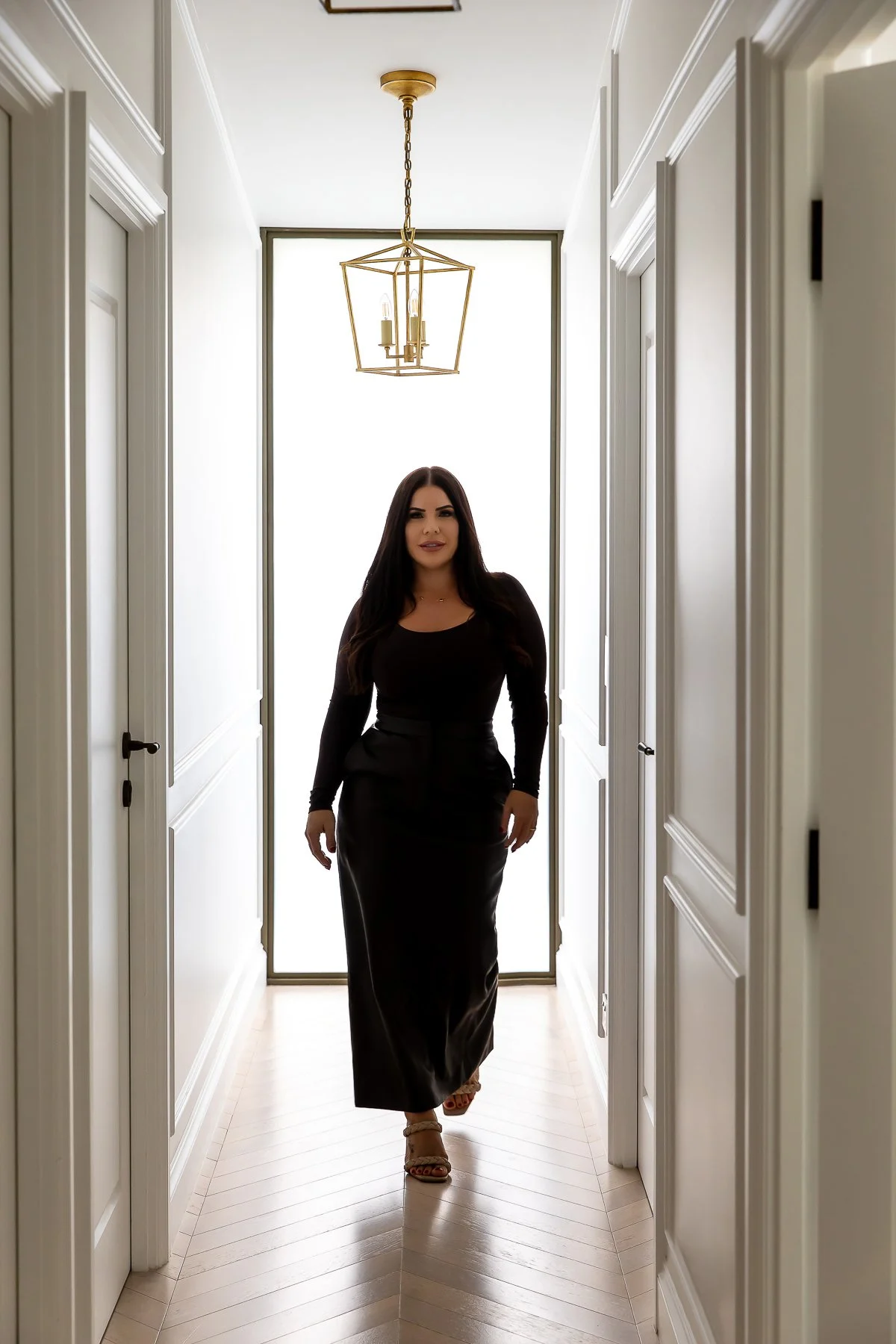 Walking with style down the hallway during a Branding shoot at Summerhope House