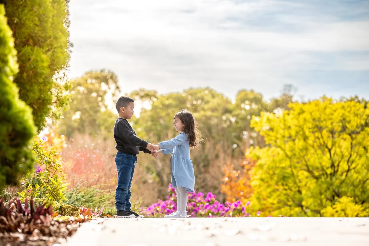 A family at Nurragingy Reserve in Sydney's Western Suburbs for a family photoshoot during the stunning colours of autumn