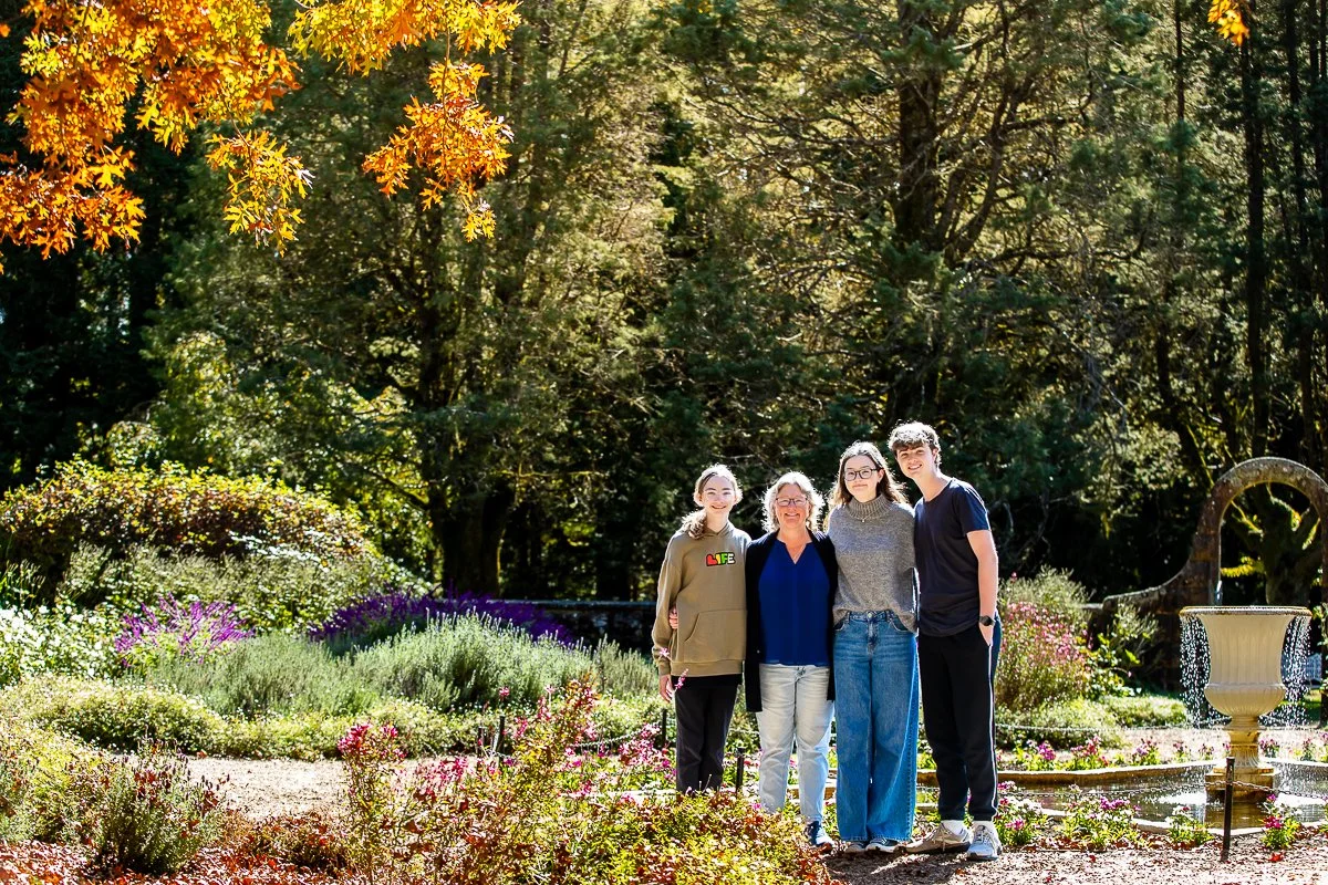 A family in the gorgeous autumn colours at Breenhold Gardens in Mount Wilson in the Blue Mountains during a family photoshoot