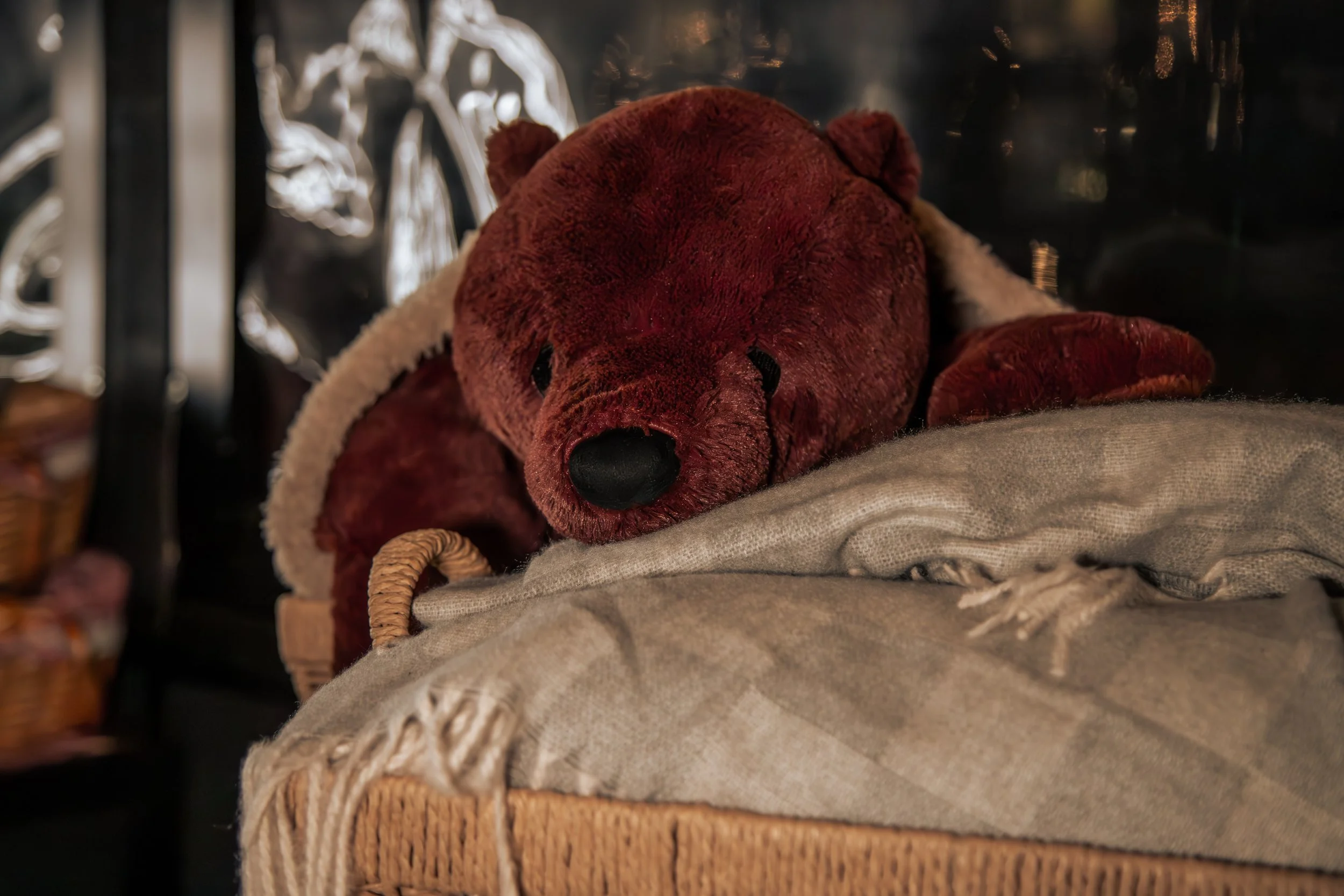 Goldilocks teddy bear tucked into a blanket for the Winter Warmers experience at Goldilocks Rooftop Bar in Melbourne CBD.