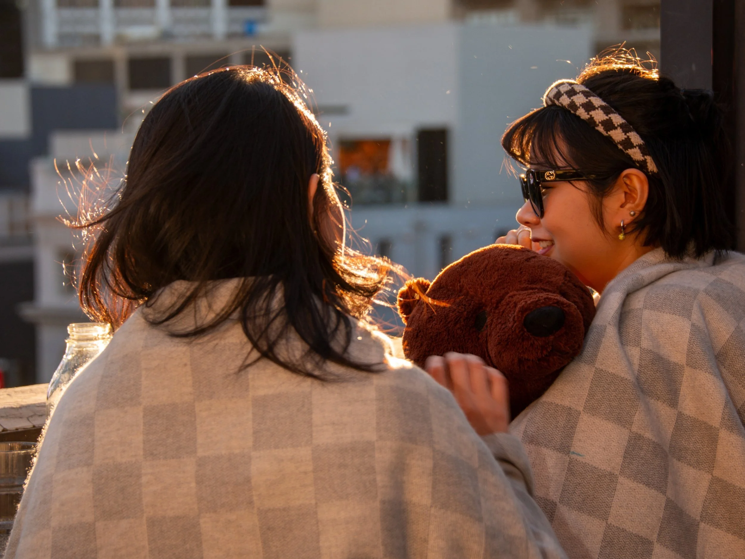 Guests staying cosy with blankets at Goldilocks Rooftop Bar, a warm winter rooftop bar in Melbourne CBD.