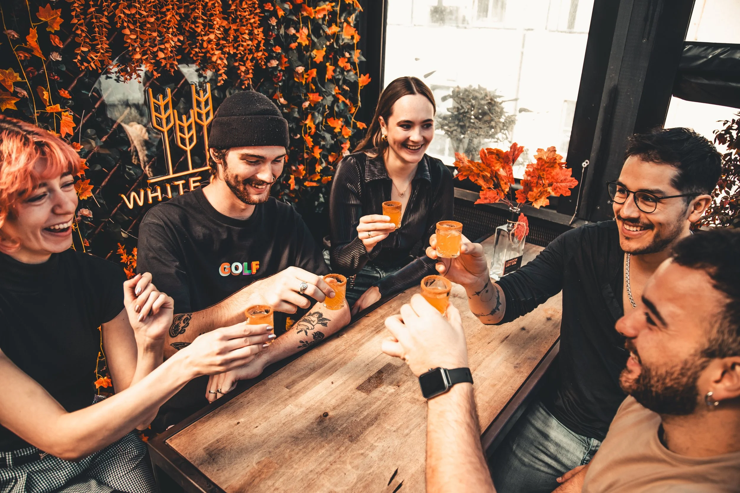 Group function at Goldilocks Rooftop Bar in Melbourne CBD, with guests enjoying drinks, rooftop seating and a relaxed celebration atmosphere.