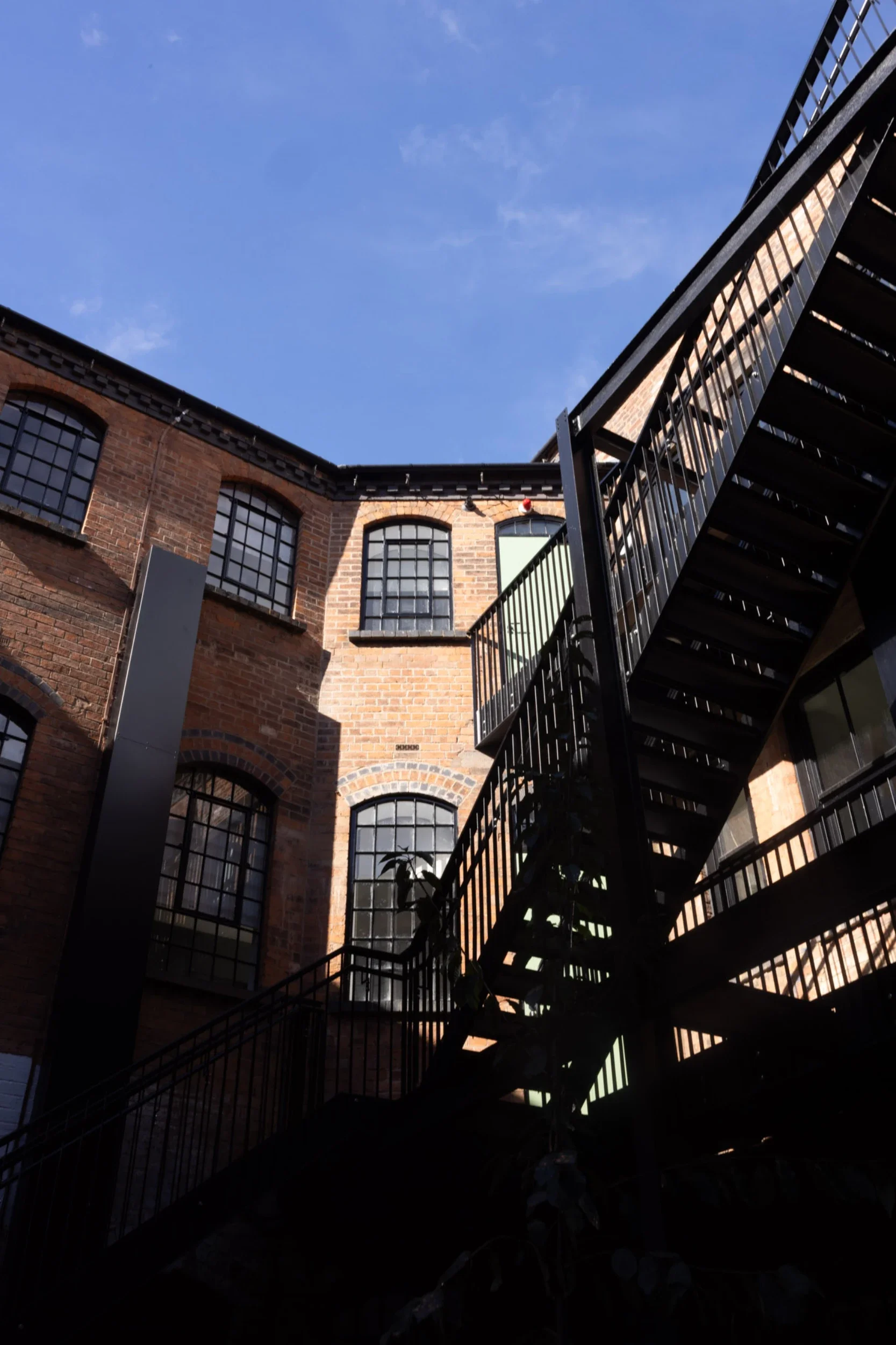 Victorian button factory transformed into a 29-apartment building. Interior design by San Stae.