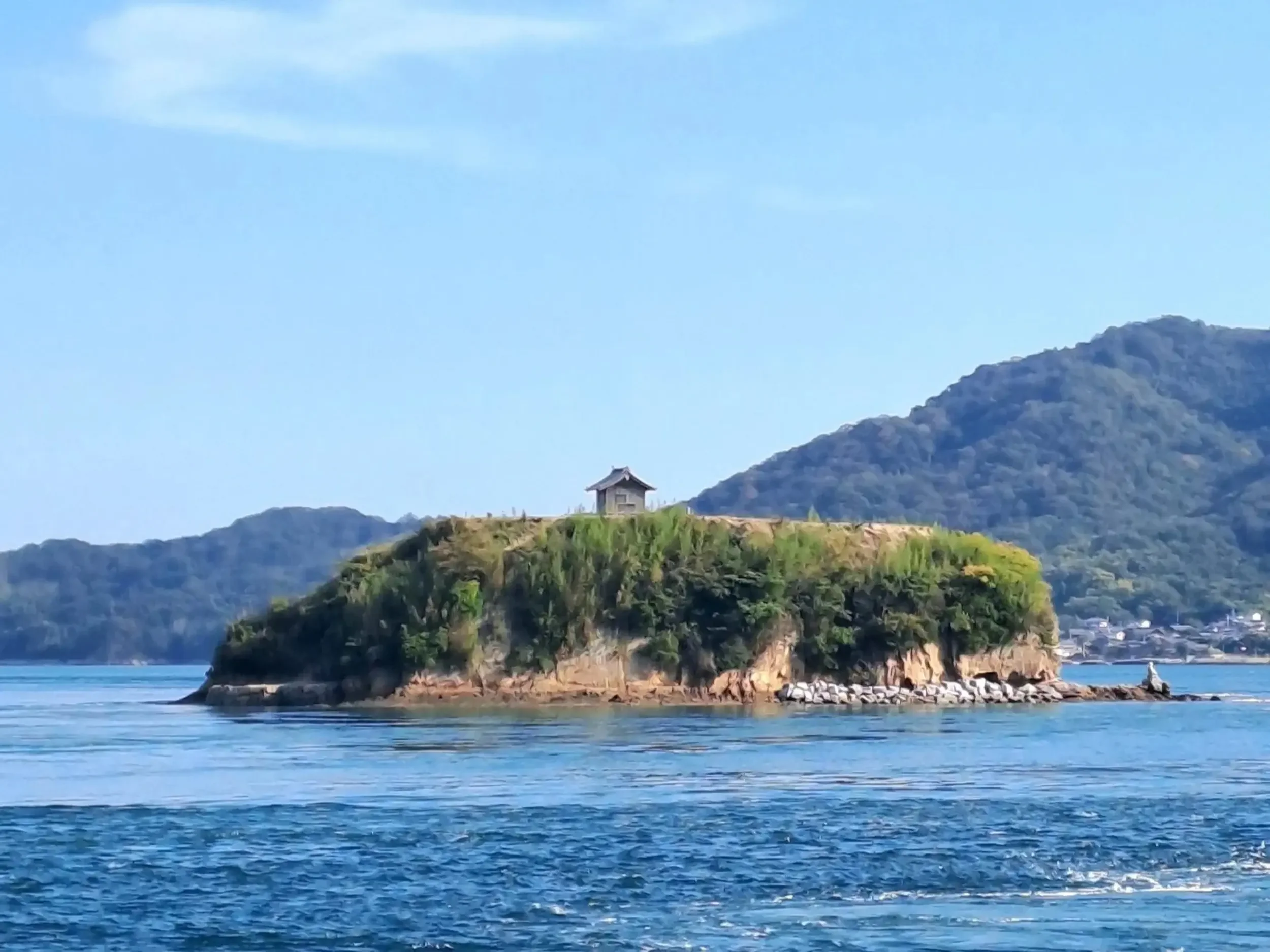 Small Japanese hut on an island.