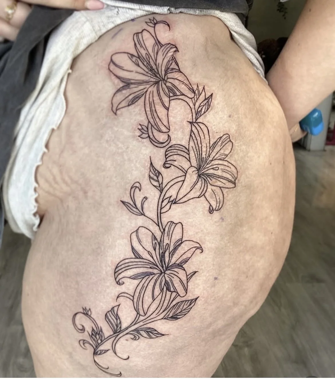 Cute fineline floral tattoo done by ceidi corbally at banjaxed ink tattoo studio dublin ireland fine line