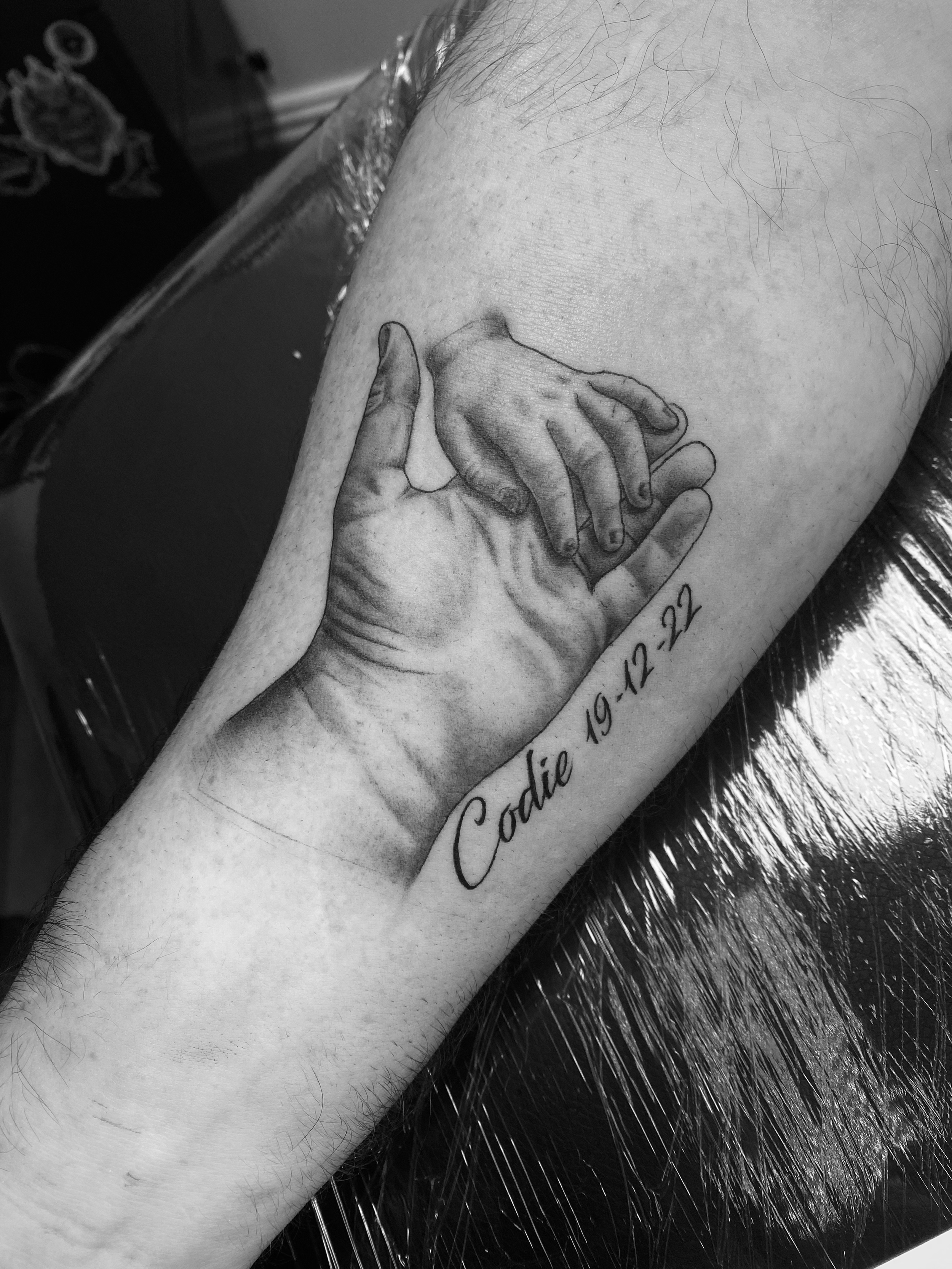 fatherhood family son hand tattoo done by kim bale tattoos at banjaxed ink irelands best tattoo studio