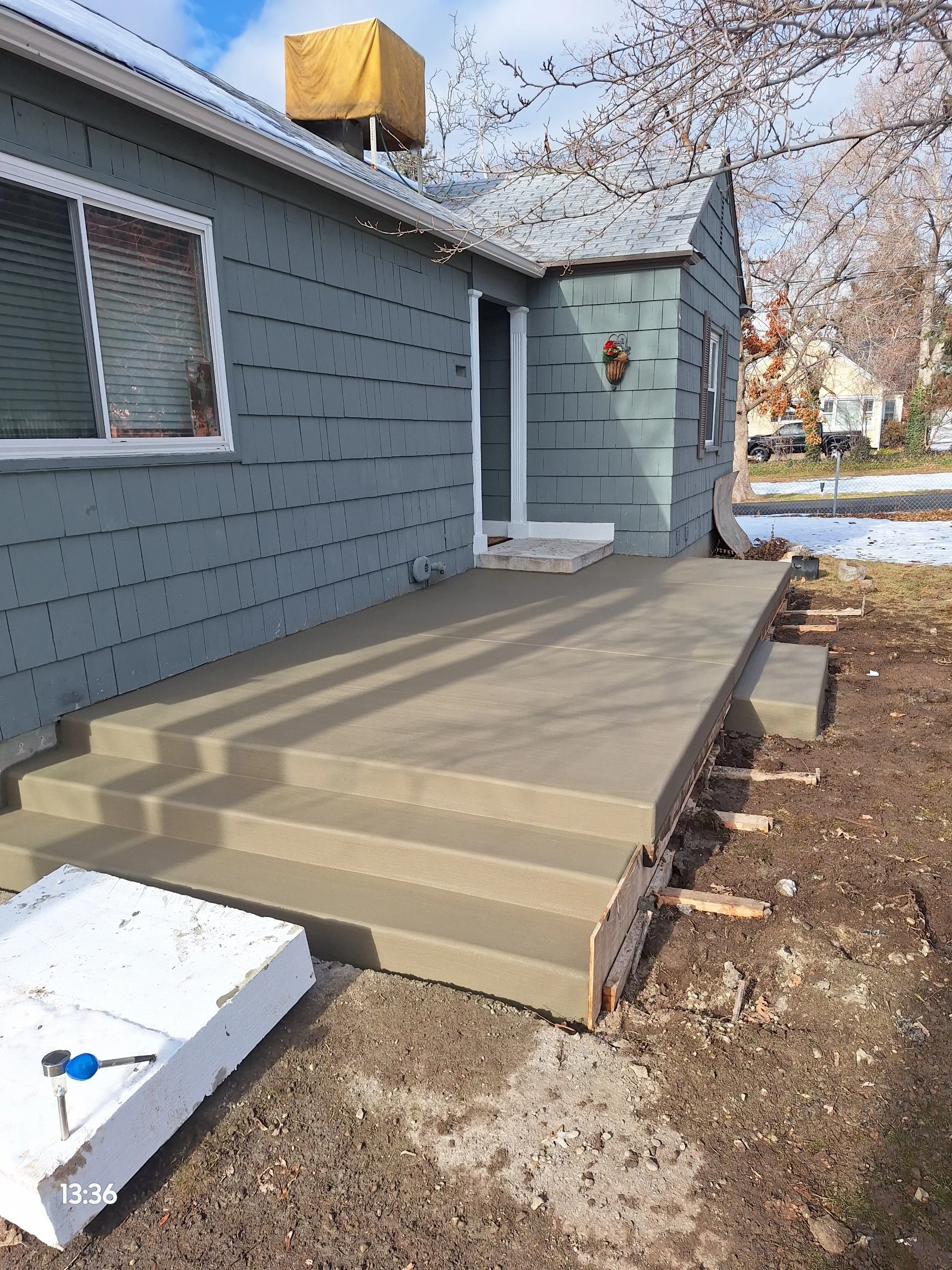 Concrete patio replacement with thickened edge porch in Millcreek, Utah