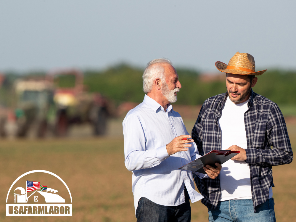 image of farmers reviewing their previous H2A season